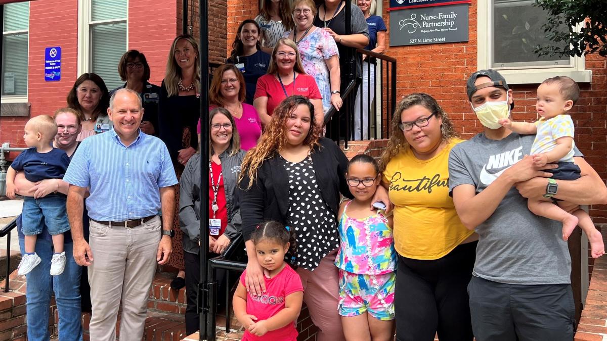 Rep. Smucker pictured with families participating in the Nurse Family Partnership program.